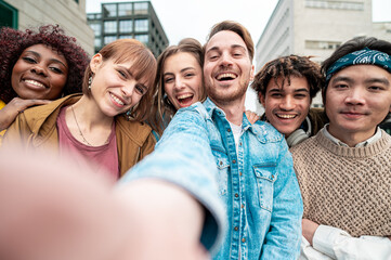 Multiracial students taking selfie and celebrate the end of session of examination, teal & orange light effects
