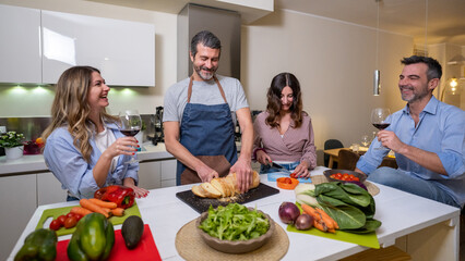 Mature couple having dinner at home while preparing a vegan and healthy dinner, healthy eating concept