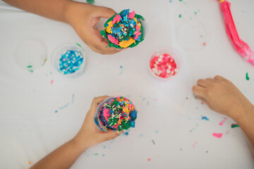children making some cup cakes