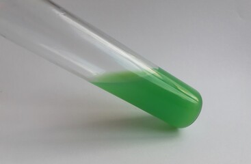 small jar. flask with green liquid. chemical experiments. medicine, scientific experiments.