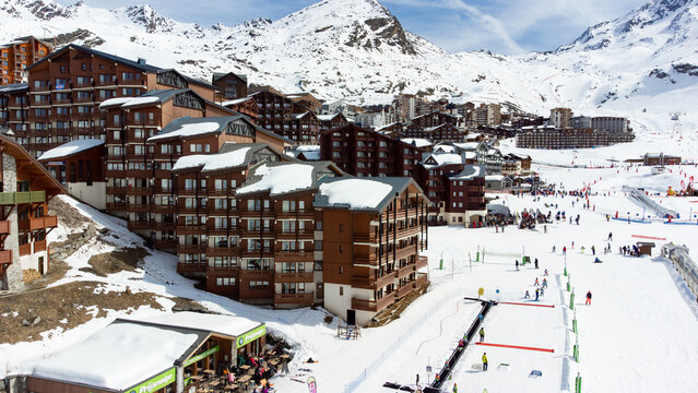 Aerial view of the snowy Val Thorens ski resort in the French Alps in winter - Luxurious hotels secluded in a white valley in altitude among high peaks and ski slopes