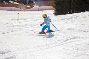 Happy family, enjoying ski holiday with children, sunny beautiful weather