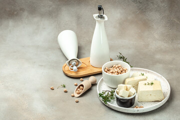 Tofu cheese slices on a light background. Non diary vegan cheese substitute alternative. Long banner format. top view - obrazy, fototapety, plakaty