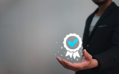 Certification and Guarantee of Quality Concept, businessman holding sign of certification or winning award of quality assurance