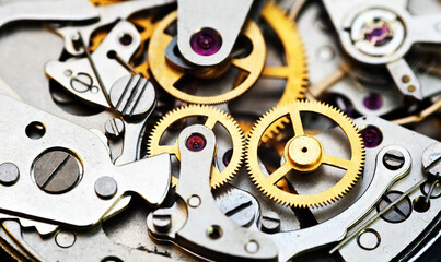 Cogwheels inside clockwork closeup