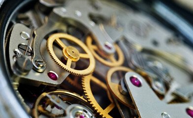 Cogwheels inside clockwork closeup