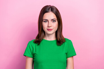 Fototapeta premium Photo of gorgeous friendly lovely girl with bob hairstyle dressed green t-shirt smiling at camera isolated on pink color background
