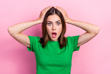 Fototapeta premium Portrait of shocked young lady arms touch head open mouth cant believe isolated on pink color background