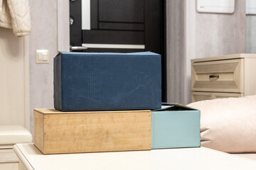 Packing boxes on the table by the door in the hallway.