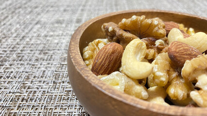 Mixed nuts in a wooden plate
