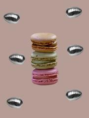 Tower of macaroons with black and white mouths around it