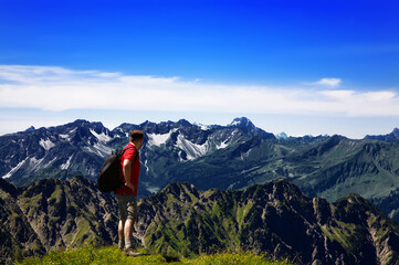 Fototapeta premium Hiker in the mountains, Allgäu Alps, Oberstdorf, Bavaria, Germany.