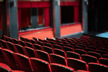 empty theater with red chairs