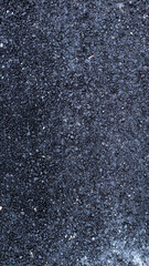 
Texture made of asphalt. Gray texture of a road covered with asphalt in a small place that leads to a small country lane.