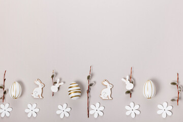 Festive Easter border, frame from easter eggs and spring flower crocus on gray background.