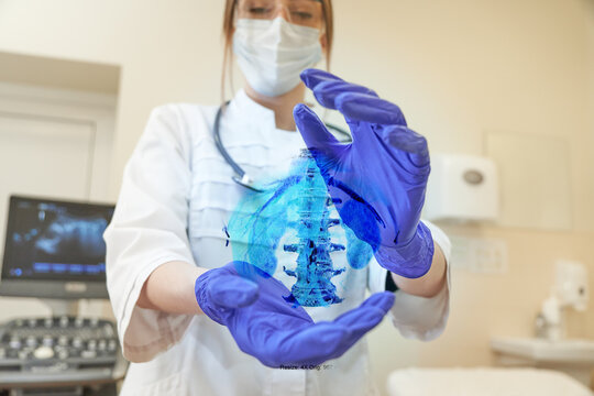 Young female scientist with a hologram of spine. Computed tomography hologram in doctor's hands. Futuristic concept of medicine.  - Powered by Adobe