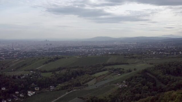 Beautiful view of a landscape with city and forest on a cloudy day