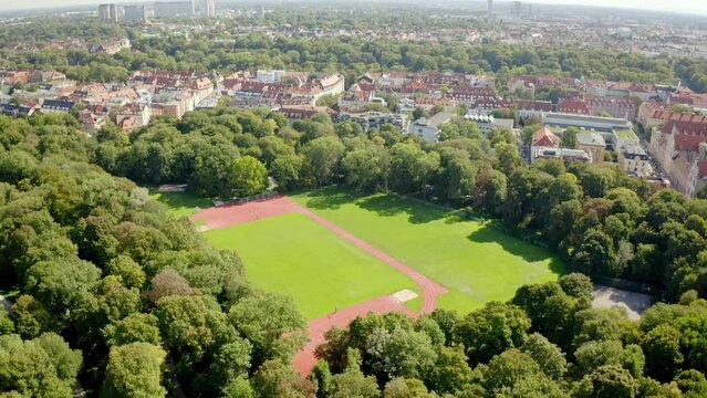 Beautiful view of buildings and park with trees in the city of Munich, Germany