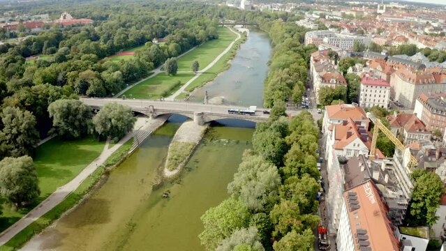 Beautiful view of a bridge with cars over the river in the city of Munich, Germany