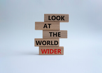 Look at the world wider symbol. Wooden blocks with words Look at the world wider. Beautiful white background. Business and Look at the world wider concept. Copy space.