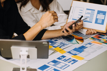 Close up ux developer and ui designer use augmented reality brainstorming about mobile app...