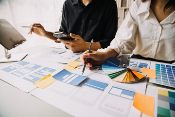 Close up ux developer and ui designer use augmented reality brainstorming about mobile app...