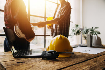 Construction and structure concept of engineer working drawing on blueprint meeting for project working with partner on model building and engineering tools in working site, construction concept