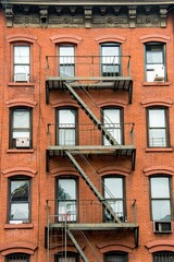 windows of a building in classical New york style stairs firestairs