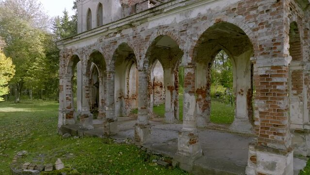 Aerial view of the ruins of Krupe Castle with trees in the background, in Lublin, Poland