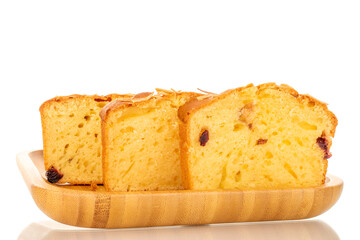 Three pieces of fragrant homemade raisin cake on a bamboo tray, macro, isolated on white background.