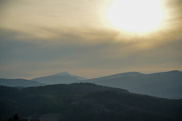 View of the mountain tops during sunset - obrazy, fototapety, plakaty