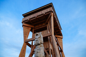 Wooden lookout tower against the sky
