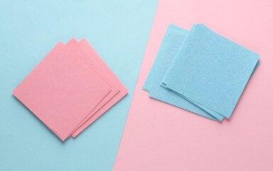 Fototapeta premium Blue and pink memo square papers on a blue-pink pastel background. Template for design