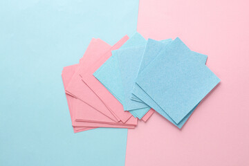 Blue and pink memo square papers on a blue-pink pastel background. Template for design