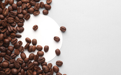 Mockup of white round coaster and coffee beans on gray background. Template for design