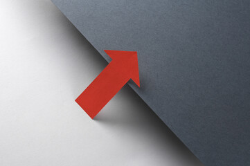 Red pointing arrow on black and gray background. Creative layout. Minimalism composition.