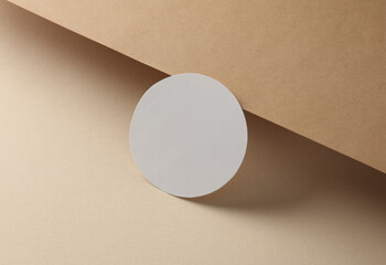 Empty white round on brown background. Creative layout. Minimalism composition.