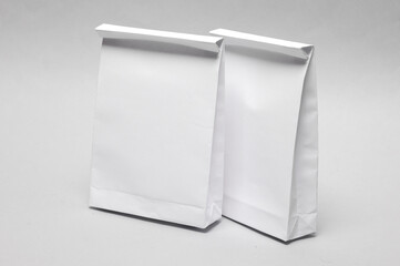 White paper lunch bags mockup on gray background