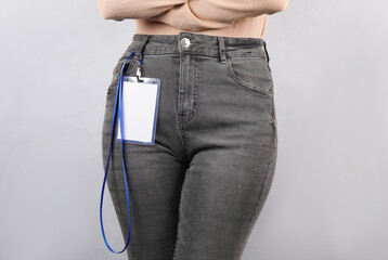 Woman with Identification white blank id card on gray background