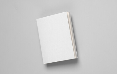 Book or notepad mockup with white cover on gray background. Template for design
