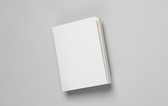 Book or notepad mockup with white cover on gray background. Template for design
