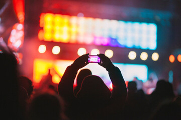 Spectator shooting video during concert