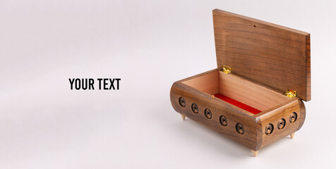 Open Wooden carving jewelry box on white background. Copy space