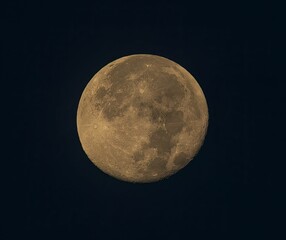Golden full moon against a black night sky