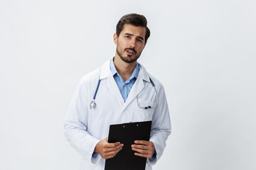 Man doctor in white coat with stethoscope and record folder and patient chart unhappy angry on white isolated background, copy space, space for text, health