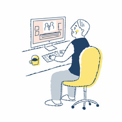 パソコン作業をしているシニア男性