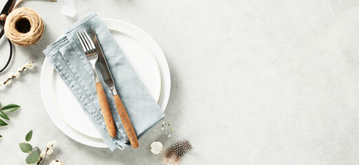 Easter table setting with spring flowers and cutlery. Holidays background