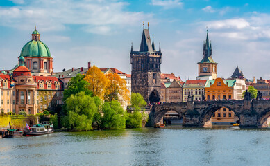 Obraz premium Prague cityscape with Old Town Bridge Tower and Charles bridge over Vltava river, Czech Republic