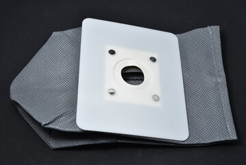 A vacuum cleaner bag. Grey bag for collecting dust in a vacuum cleaner.