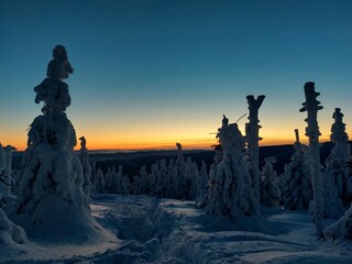 Fototapeta premium Hike to mountain Smrk in Beskydy, Czech; sunshine in mountains, forest with snow